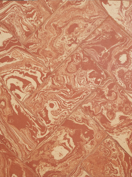 Superficie in terracotta con venature bianche